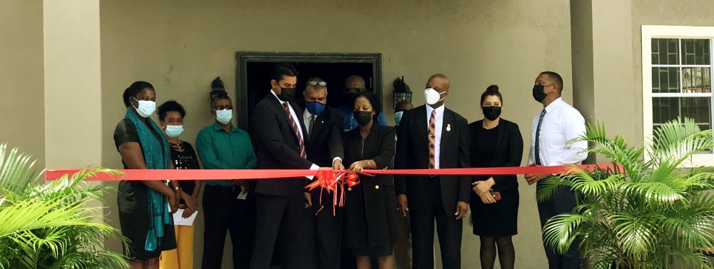 The ribbon is cut by Minister Ramson, Mr. Kashir Khan and Ms. Goldie Scott