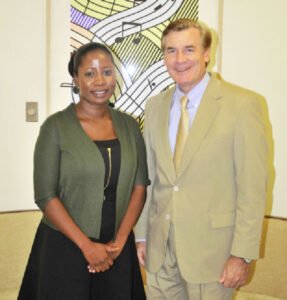 Ms. Scott during a ceremony with former US Ambassador to Guyana, D. Brent Hart.